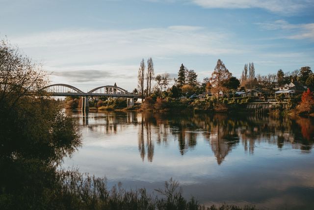 The Waikato River in autumn with the Fairfield Bridge in Hamilton behind.